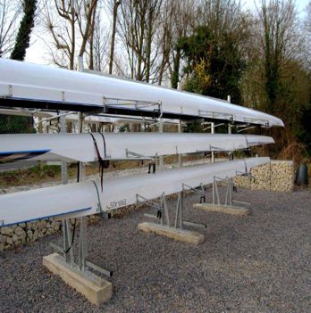 Outdoor multi-tier Swift boat rack with three boats stacked